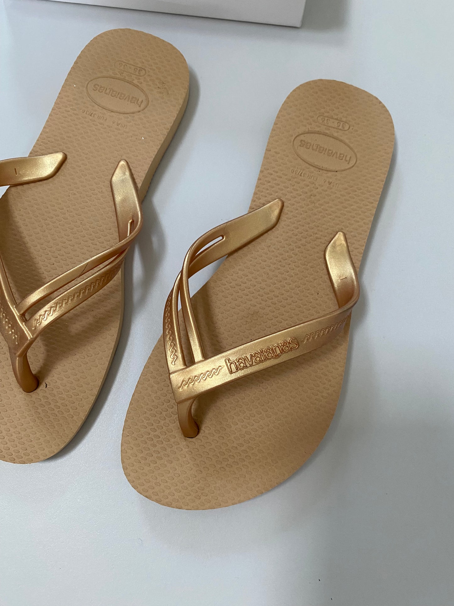 Gold havaianas flip flops UK 4